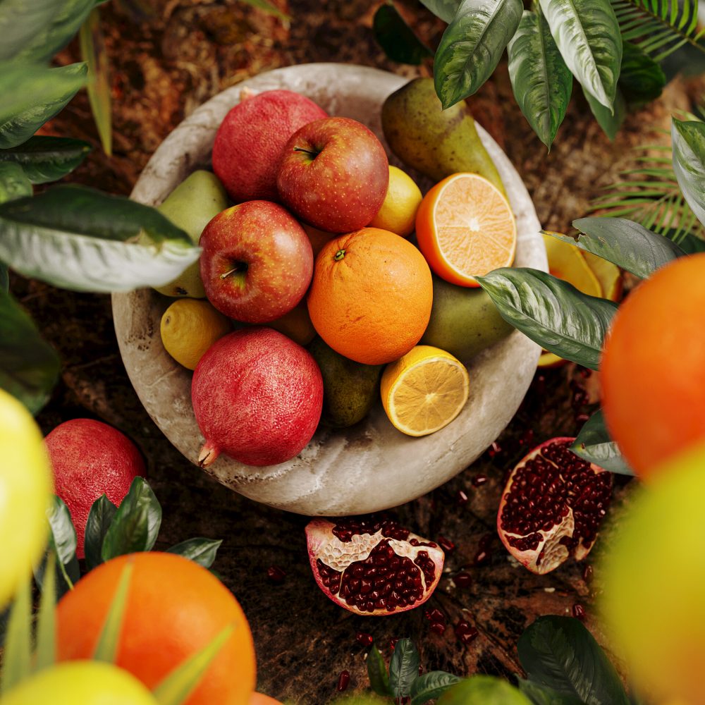 Wizualizacja produktowa na konkurs owoce w tropikalnym ujęciu umieszczone w półmisku, jabłko cytryna granat pomarańcz fotorealistyczna wizualizacja natury